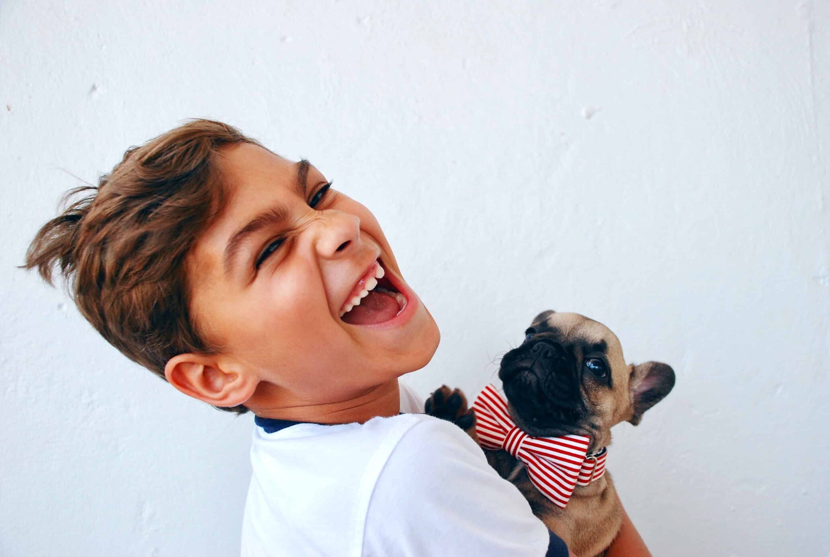 boy with newly groomed puppy